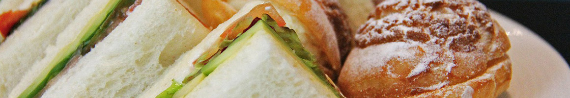 Eating Gastropub Sandwich at Lettuce & Tomato Gastrobar restaurant in North Miami Beach, FL.